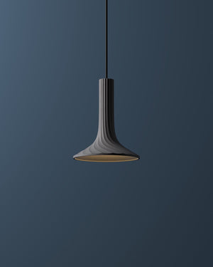 Pendant light fixture against a dark blue background