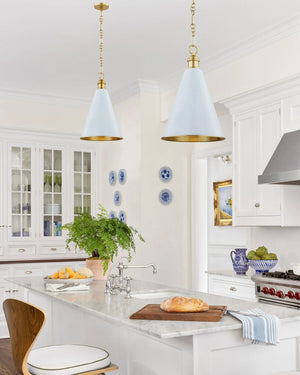 Two Soft Blue conical pendant lights hanging above a kitchen island with marble benchtop