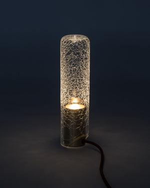 Crackle table lamp with a blue backdrop