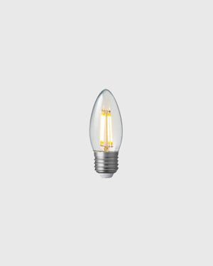 Clear LED light bulb on a grey background
