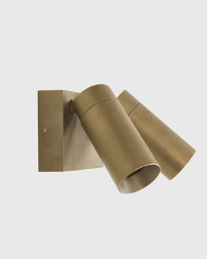 An architectural lighting in brass finish for exterior lighting