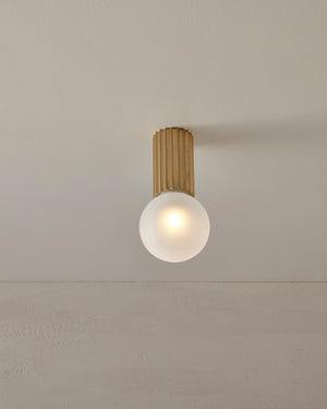 Ceiling light fixture with wooden finish and white bulb on a neutral ceiling.