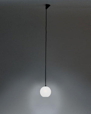 Spherical pendant light hanging against a dark background