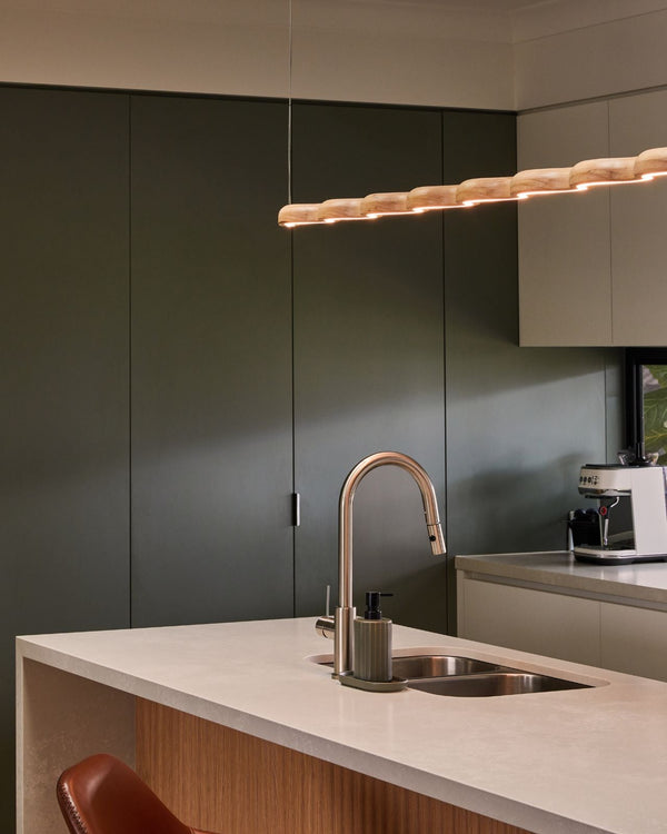 Wiggle timber pendant in a green contemporary kitchen