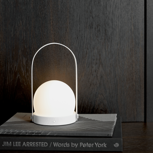 Lightweight Metal Modern Mobile Lantern | Carrie white finish on a bookshelf