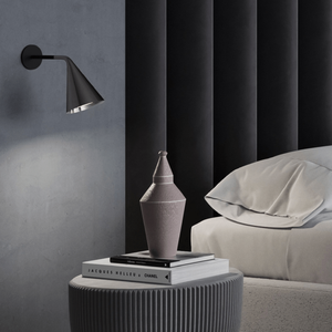 Long Angled Arm Conical Wall Light black and chrome finish in a bedroom