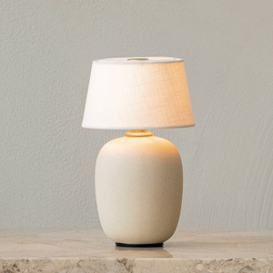Intimate Portable Ceramic and Linen Table Lamp | Torso Sand on a table