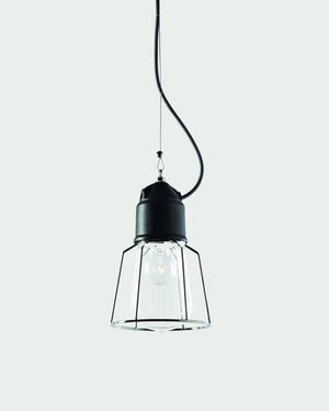Pendant light with clear glass shade and black metal fixture on a white background