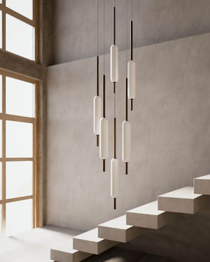 Frosted Tubular Brass Suspended Pendant  6 Light variant displayed in a modern stairwell