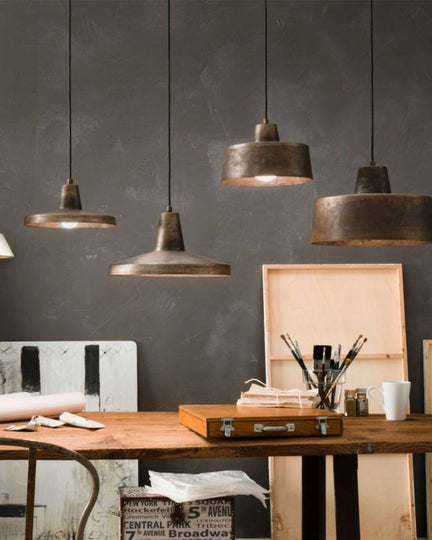 Italian Industrial Vintage Style Pendants with a mix of sizes and shaped in an artist room