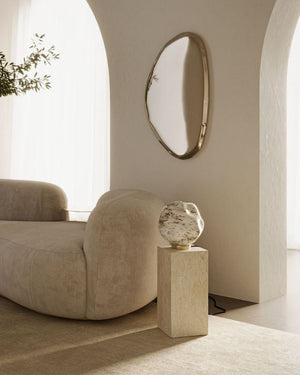 Refined Textured Glass Table Lamp with brass finish in a beige living room