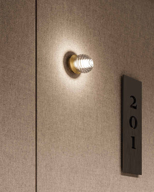 Delicate Ridged Glass Spherical Wall or Ceiling Light Installed on a hotel wall