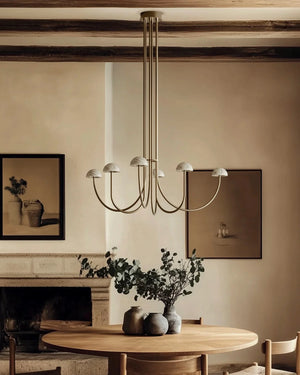 Marble and Curved Arm Chandelier Over a dining table 