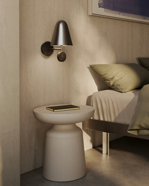 Modern bedroom with a side table, Nordic Marble Wall Light, and bed.