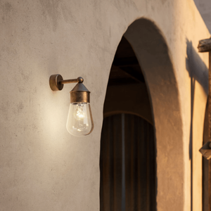 Mini Antique Brass Wall Light | Lighting Collective | in a patio