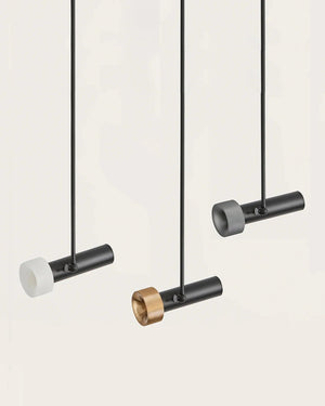 Modern pendant lights with black and gold fixtures on a white background