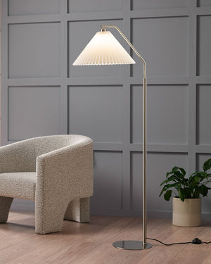 Pleated Cotton Shade Floor Lamp against a gray paneled wall | Lighting Collective