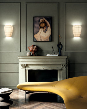 Pongé Fabric Wall Light in warm white shade illuminating either side of a fireplace mantel
