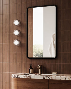 Ribbed Glass Framed Orb Wall Light Styled in Contemporary Bathroom