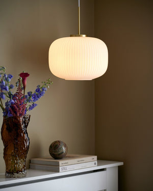 Scandinavian Decorative Glass Pendant with Brass Detailing suspended over a hallway console - Lighting Collective 