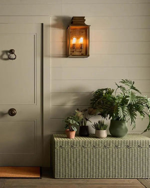 Wide brass lantern installed outside entryway