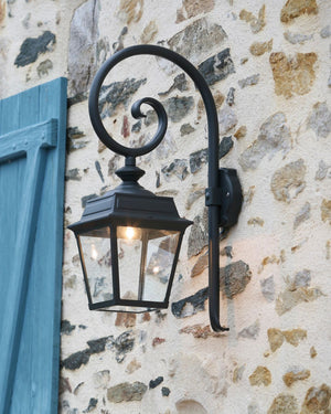 Ornamental wall lantern on brick facade