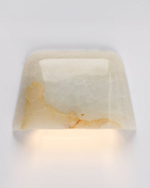 Curved square wall fixture with honey marble pattern