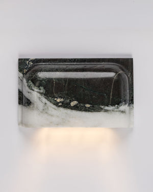 Marble-patterned wall light fixture on a white background