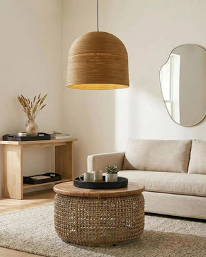 Natural rattan dome shade pendant installed above coffee table.