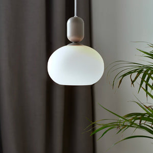 contemporary ovate matt glass and metal pendant grey finish in a living room