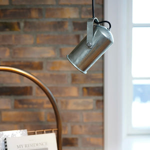 industrial galvanised pendant light in a living room