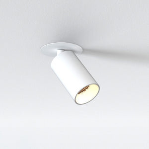 integrated led recessed spotlight with white finish and light turned on