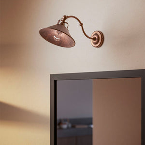 Brass Fixed Arm Wall Light curved version over a mirror