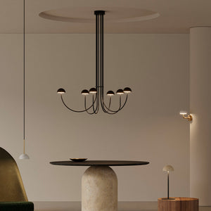 marble and curved arm chandelier with black marble and black finish over a dining table