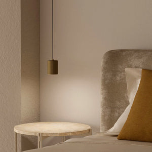 mini cylindrical suspended pendant with brass finish as a beside lamp