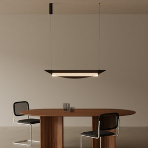 modern black rattan folded shade pendant light above a dining table