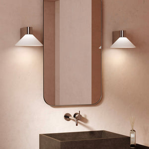 modern blown glass cone wall light with polished chrome in a bathroom