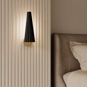 modern corrugated steel wall sconce as a bedside lamp in a cosy bedroom
