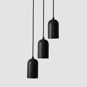 modern organic dome pendant black fixing and lava stone material clustered in a line with different heights