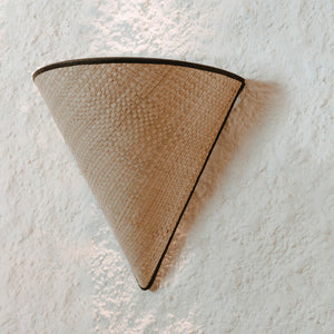 organic woven half-cone wall light on a white wall