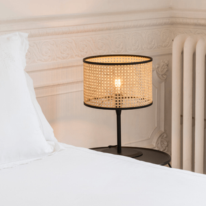 Mediterranean Rattan Cane Table Lamp on a bedside table