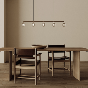 Delicate Ridged Glass Spherical Linear Pendant over a dining table